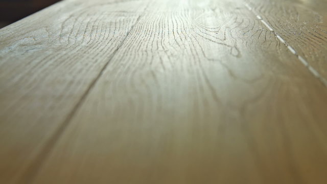 New oak parquet of brown color - dolly motion. RAW video record.