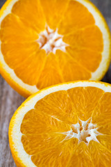 Orange slice on the grey  background.