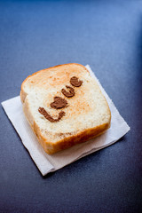 Love message on Bread sliced on leather background.