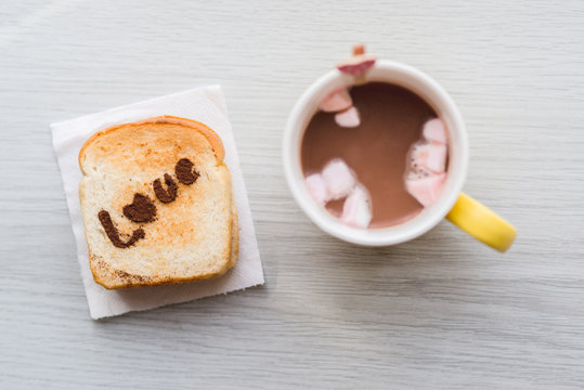 Love message on Bread sliced and chocolate cup and marshmellows