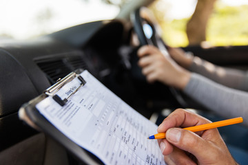 student driver taking driving test - 102663198