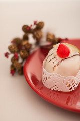 Italian cassata cake on the red plate