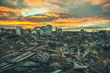 Apocalyptic landscape.The ruins of the destroyed buildings at sunset - obrazy, fototapety, plakaty