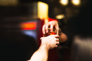 Bartender gives ready cocktails