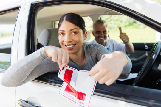 girl tearing a L sign