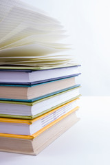 Stack of hadrback books on white background. Library education concept. Back to school. Copy space