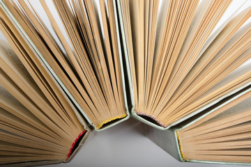 Stack of hadrback books on white background. Library education concept. Back to school. Copy space