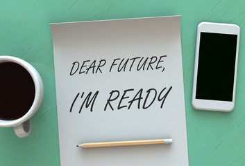 Dear Future Im Ready, message on paper, smart phone and coffee on table
