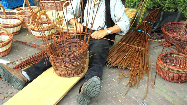 The traditional craft of weaving baskets in Historical Market Veere (Netherland).