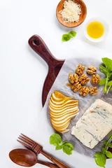 Fotobehang appetizer tray , cheeseboard with gorgonzola, arugula, walnuts a © irinagrigorii