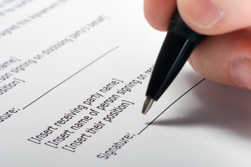 Businessman's hand signing papers. Lawyer, realtor, businessman 