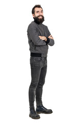 Funny laughing bearded man in tight jeans and army boots looking at camera. Full body length portrait isolated over white studio background. 