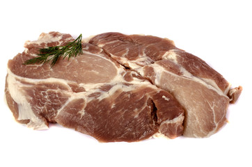 Raw pork steak on white background close-up.