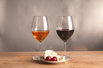 Refined still life of wine and cheese on wooden table