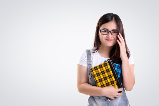 Cute smiling girl with nerd glasses on white