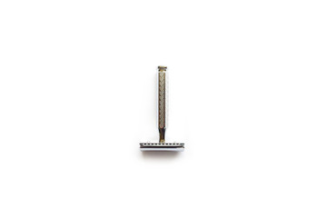 vintage chrome plated razor on a white background seen from above