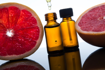 Grapefruit essential oil, extract, essence, in amber bottle with dropper - 102674793