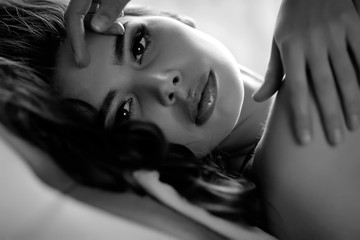 portrait of sexy woman in bed, bw 