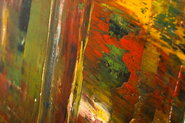 Abstract painted canvas. Oil paints on a palette.
