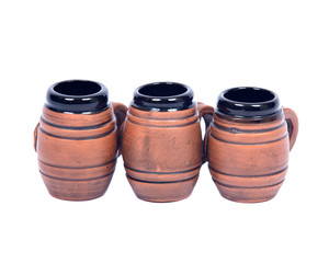 Decorative beer mugs separated on white backboard