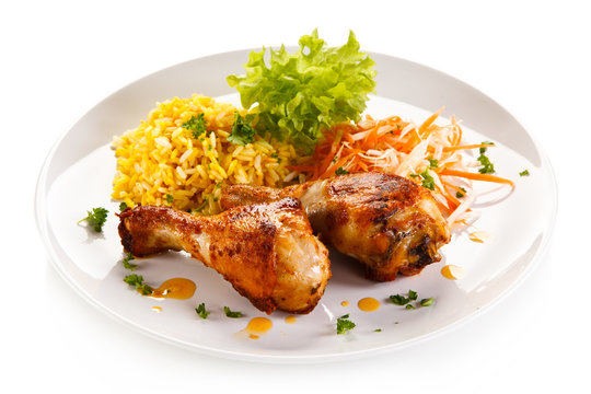 Roasted chicken drumsticks white rice and vegetables