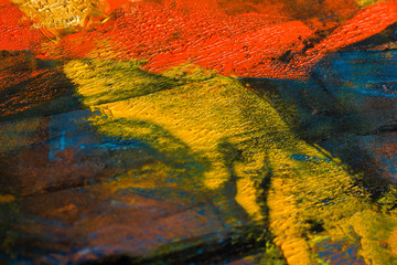 Naklejka premium Abstract painted canvas. Oil paints on a palette.