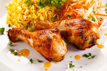 Roasted chicken drumsticks white rice and vegetables