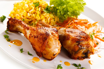 Roasted chicken drumsticks white rice and vegetables