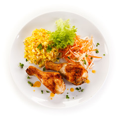 Roasted chicken drumsticks white rice and vegetables