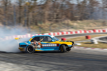 Sport car burnout on the track