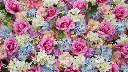 Many artificial flowers background.