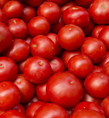 Fresh tomatoes in a market stall.