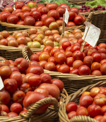 Fresh tomatoes in a market stall.