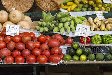 Fresh tomatoes in a market stall.