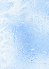 Small frosty patterns on glass in light tones