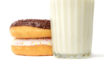 Glass of milk and donuts