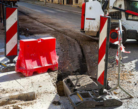 mini excavator with crown accessory has performed the mini trench for the construction of infrastructure with optical fibers