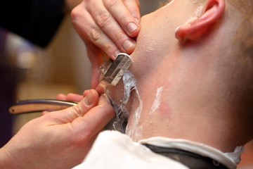 Barber shave and modeling beard by razor