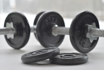 Naklejka na ściany i meble Dumbbells for weightlifting sessions.