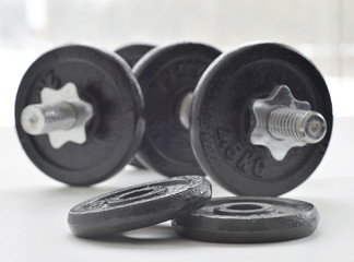Obraz na płótnie Canvas Dumbbells for weightlifting sessions.