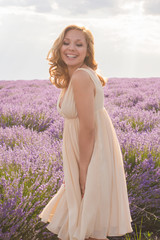 Beautiful young woman portrait in lavender field