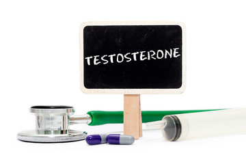 TESTOSTERONE concept with text on chalkboard with stethoscope, syringe and pills
