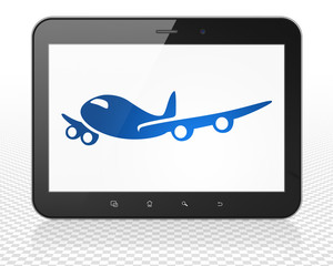 Vacation concept: Tablet Pc Computer with Airplane on display