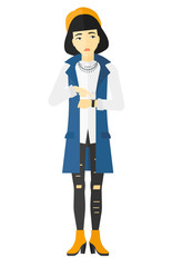 Angry boss pointing at wrist watch.