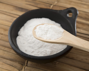 baking soda (Sodium bicarbonate) on a wooden spoon