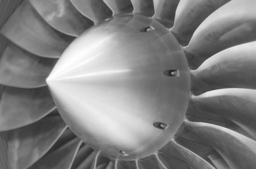 Close up view of an airplane turbine in black and white