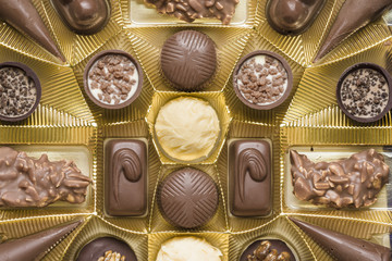 Chocolate pralines of different kinds in a box