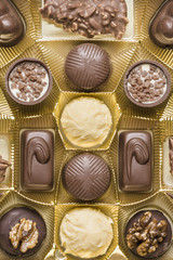 Chocolate pralines of various types in a box