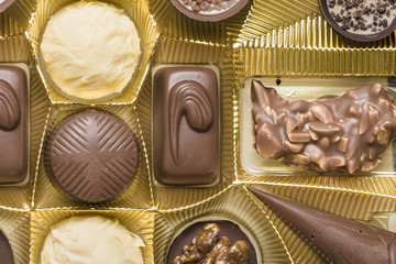Mixed types of chocolate pralines in a box