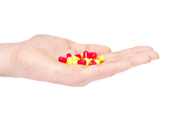 close up round white pill in hand